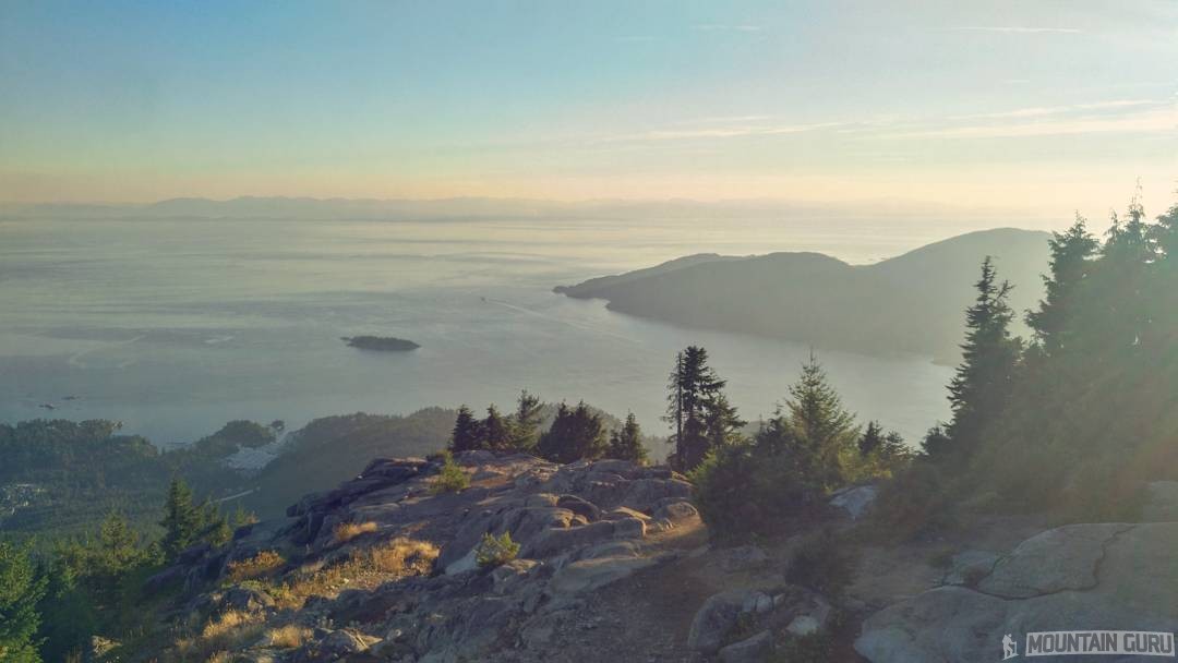 As the sun starts to set over the Howe Sound, there are no visible trail markers and it's unclear where the Baden Powell Trail continues.