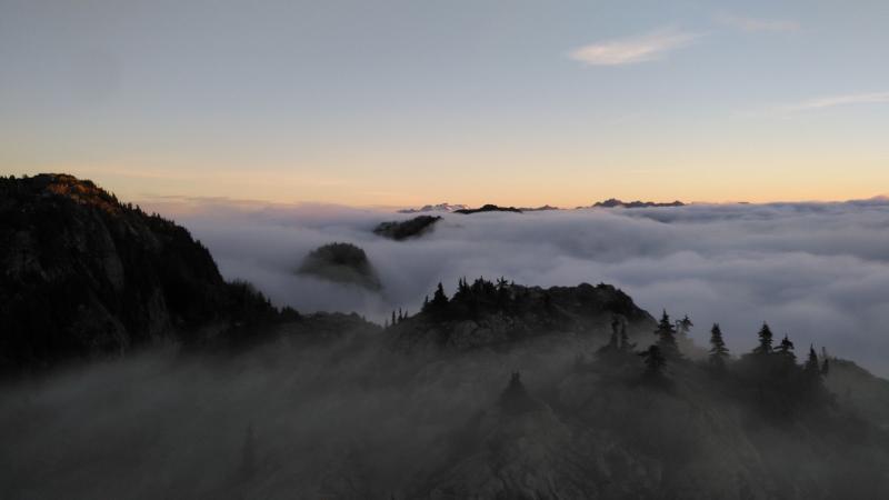 Above the clouds at sunrise on First Peak